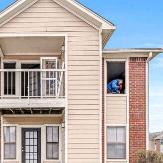 two men installing a window